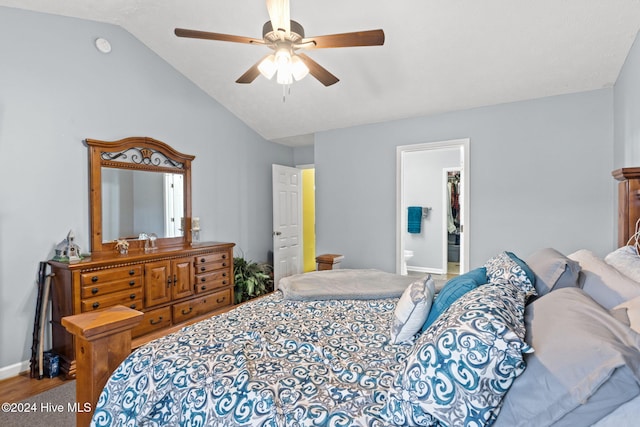 bedroom with ensuite bath, ceiling fan, and lofted ceiling