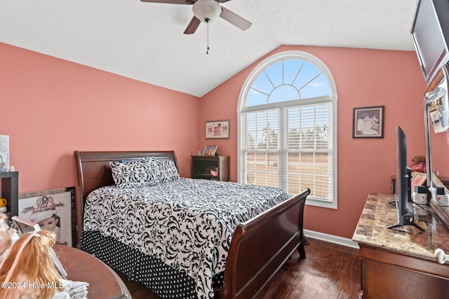 bedroom with a textured ceiling, ceiling fan, dark hardwood / wood-style flooring, and lofted ceiling