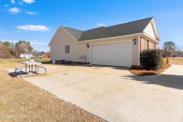 view of side of home with a garage