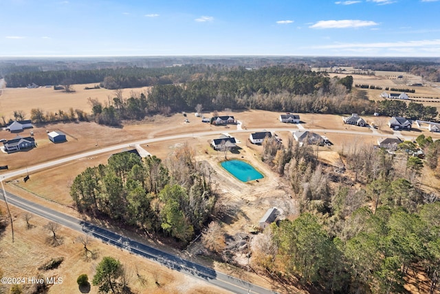 birds eye view of property with a rural view