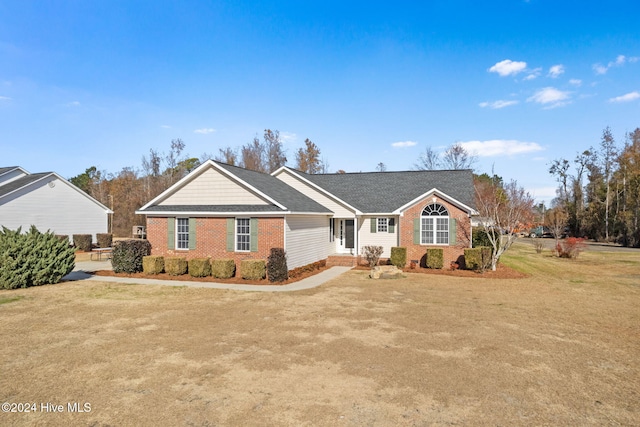 ranch-style house with a front yard