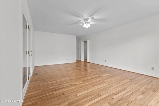 spare room featuring ceiling fan and light hardwood / wood-style floors