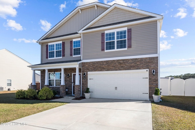 craftsman-style house featuring a front yard and a garage