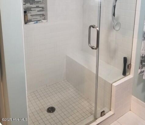 bathroom featuring a shower stall