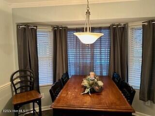 dining space featuring baseboards