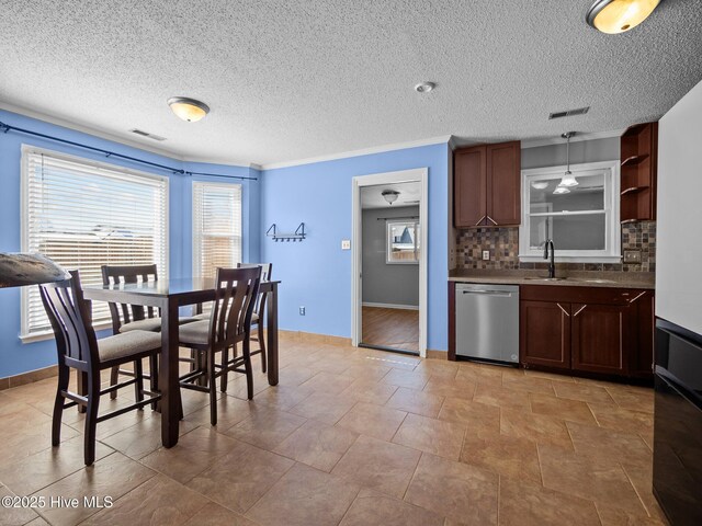 kitchen with decorative backsplash, appliances with stainless steel finishes, sink, and ornamental molding