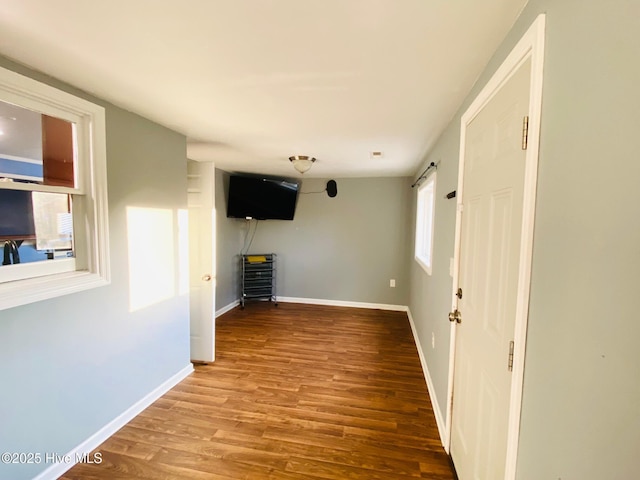 unfurnished living room with hardwood / wood-style flooring