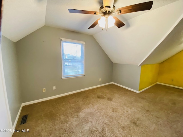 additional living space featuring lofted ceiling, ceiling fan, and carpet