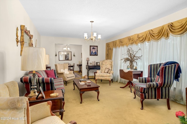 carpeted living room with an inviting chandelier