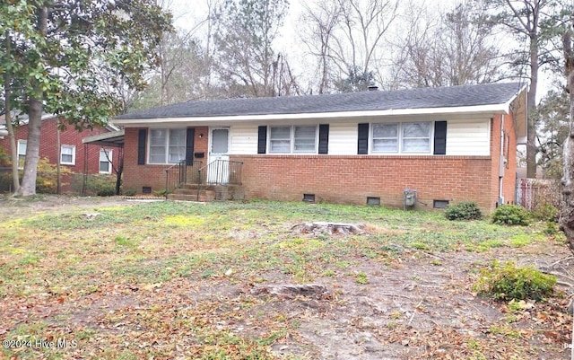 single story home featuring a front yard