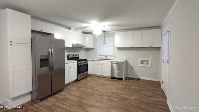 kitchen featuring white cabinetry, sink, dark hardwood / wood-style flooring, crown molding, and appliances with stainless steel finishes