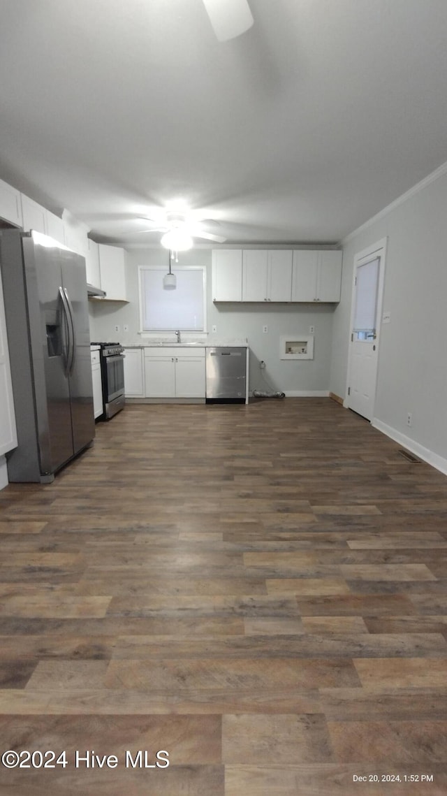 kitchen featuring dark hardwood / wood-style flooring, white cabinetry, and stainless steel appliances