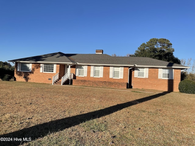 single story home featuring a front yard