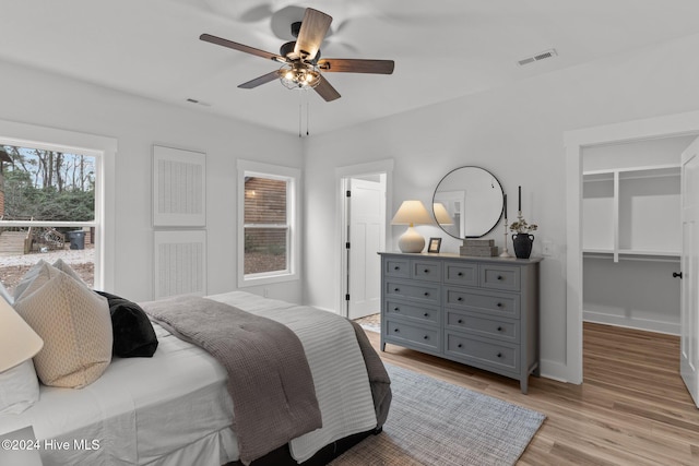 bedroom featuring light hardwood / wood-style floors and ceiling fan