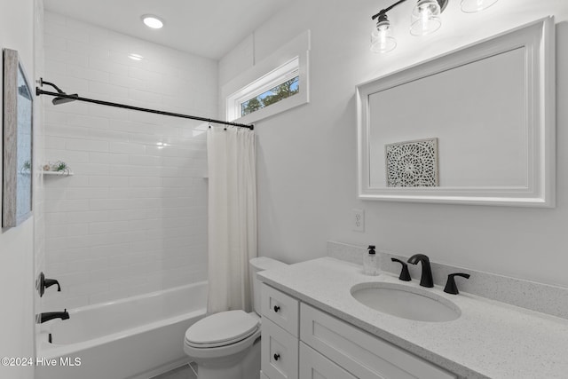 full bathroom with vanity, toilet, and shower / tub combo with curtain