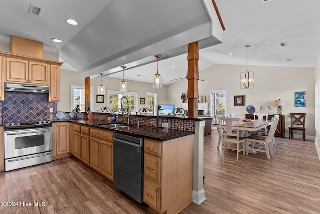 kitchen featuring dishwashing machine, under cabinet range hood, a peninsula, visible vents, and stainless steel range with electric stovetop