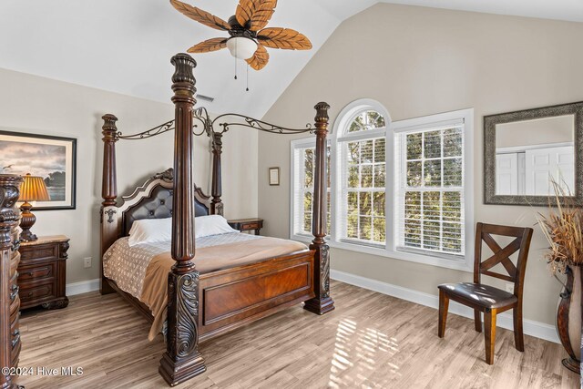 laundry room featuring separate washer and dryer, crown molding, and light hardwood / wood-style flooring