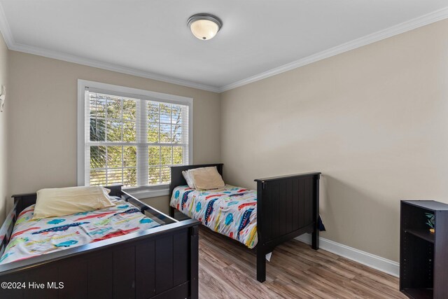 sitting room featuring light hardwood / wood-style flooring, vaulted ceiling, and a wealth of natural light