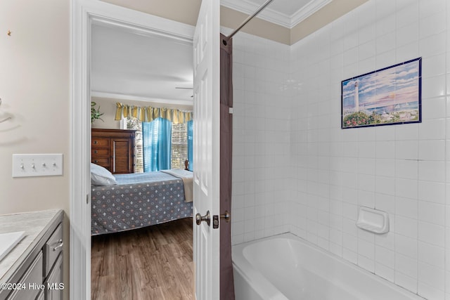 ensuite bathroom featuring ensuite bath, ornamental molding, wood finished floors, shower / tub combo with curtain, and vanity