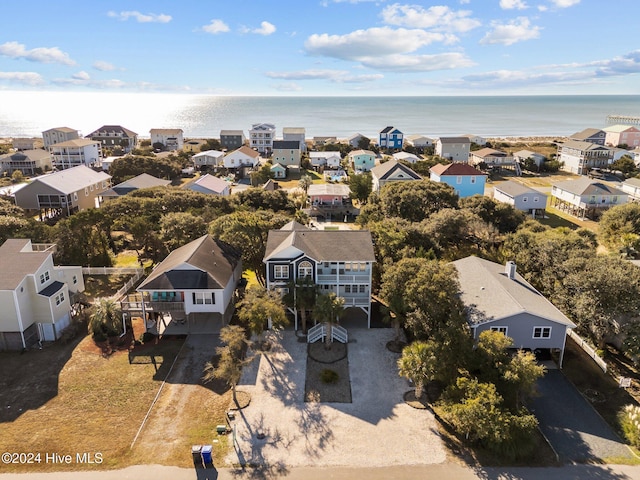 birds eye view of property with a water view and a residential view