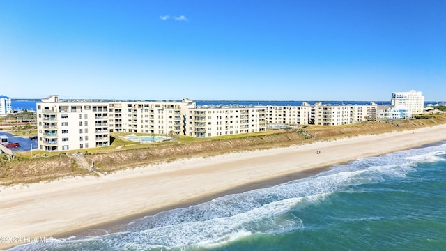 aerial view with a water view and a view of the beach