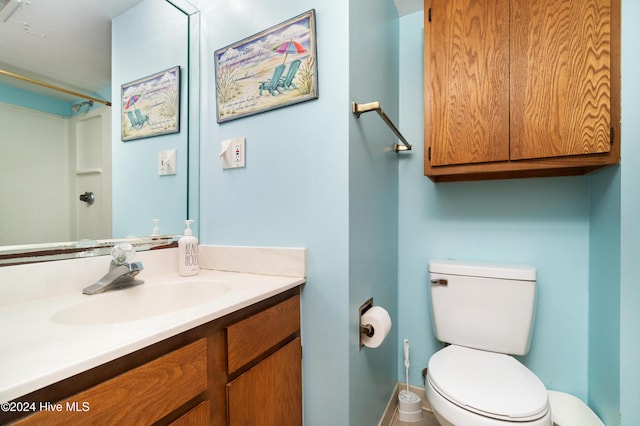 bathroom featuring vanity and toilet