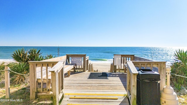 view of property's community with a view of the beach and a water view