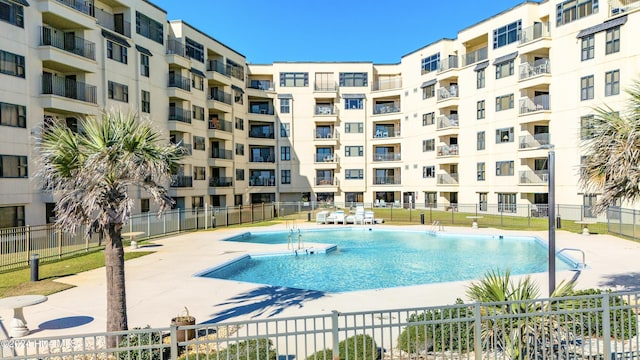 view of swimming pool with a patio