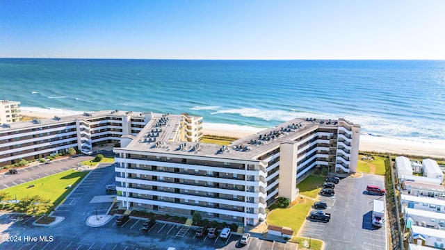 aerial view with a water view and a view of the beach