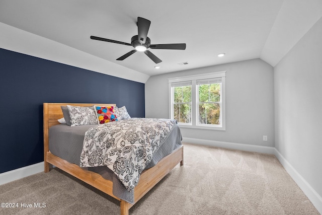 carpeted bedroom with ceiling fan and lofted ceiling