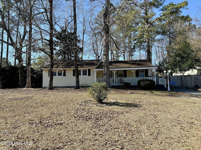 single story home with covered porch