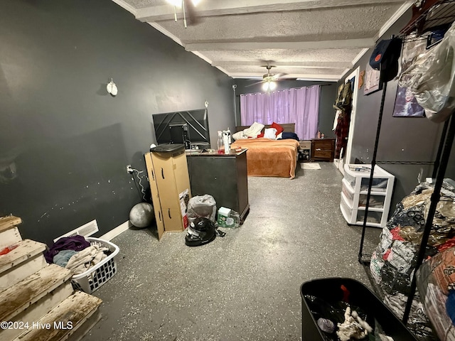 bedroom with ceiling fan and beamed ceiling