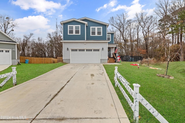 view of property featuring a garage and a front yard