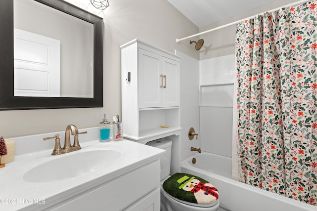 full bathroom featuring shower / bath combo with shower curtain, vanity, and toilet