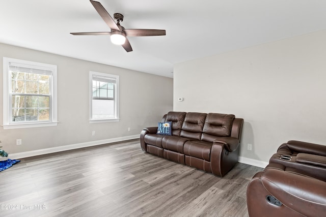 living room with hardwood / wood-style floors and ceiling fan