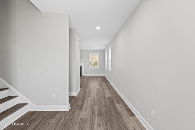 corridor with wood-type flooring