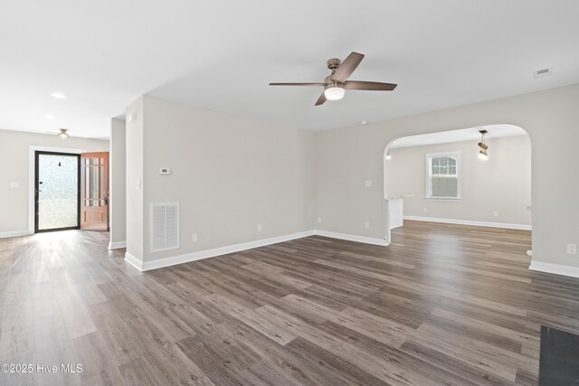 kitchen featuring stainless steel appliances, sink, pendant lighting, light hardwood / wood-style flooring, and white cabinetry