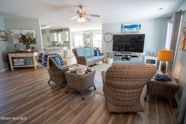 living room featuring hardwood / wood-style flooring and ceiling fan