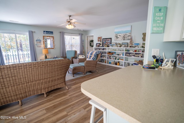 interior space with ceiling fan and hardwood / wood-style floors