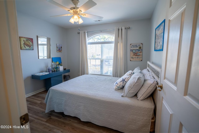 bedroom featuring dark wood-type flooring and ceiling fan