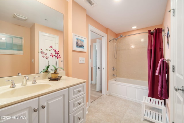bathroom featuring visible vents, shower / tub combo, vanity, and tile patterned flooring