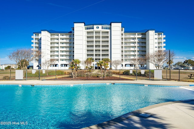 community pool featuring fence