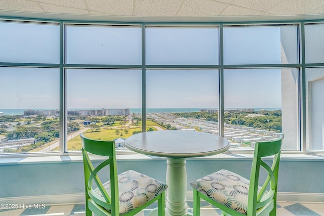 interior space with a city view and baseboards
