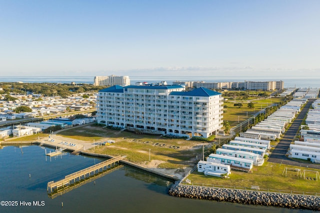 birds eye view of property featuring a water view and a city view
