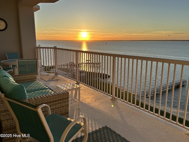 balcony with a beach view and a water view