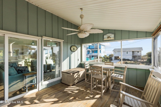 sunroom with vaulted ceiling and ceiling fan