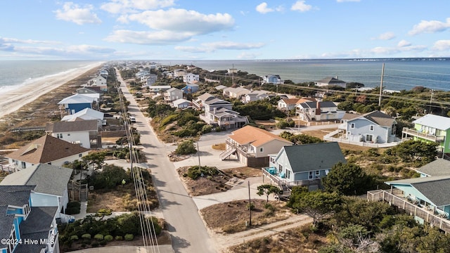 drone / aerial view with a water view and a view of the beach