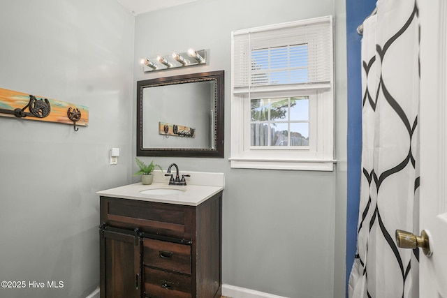 full bath featuring vanity and a shower with shower curtain