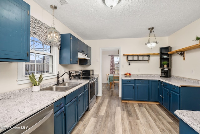 kitchen featuring a sink, open shelves, blue cabinetry, under cabinet range hood, and appliances with stainless steel finishes