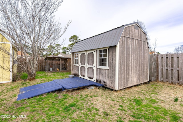 view of shed featuring a fenced backyard